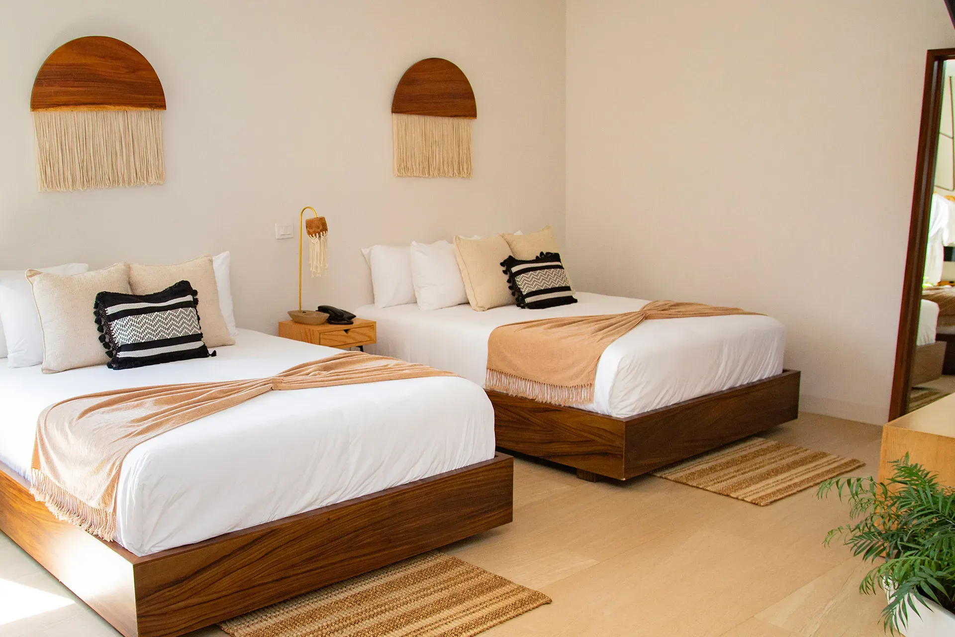 two-decorated-room-beds-in-agua-de-luna-hotel-boutique